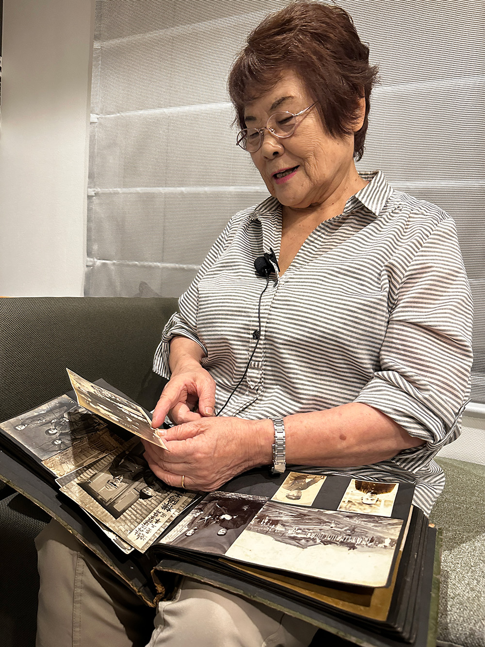 Sadako holding her family photo album