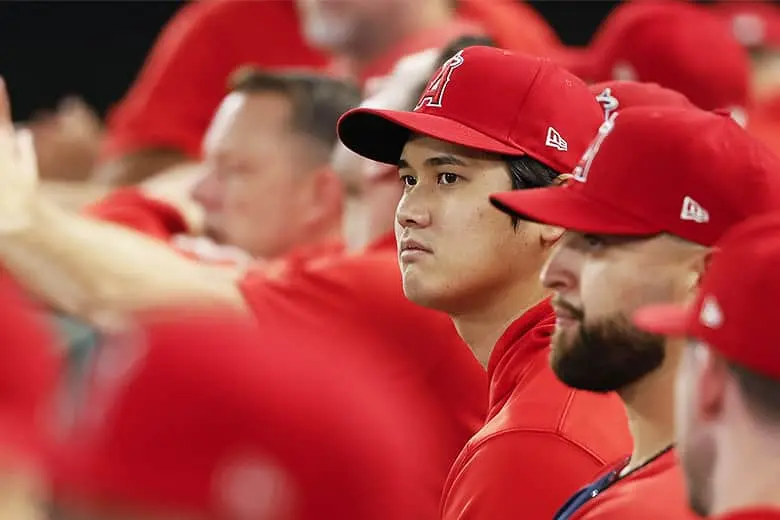 Shohei Ohtani watching the game from the bench.