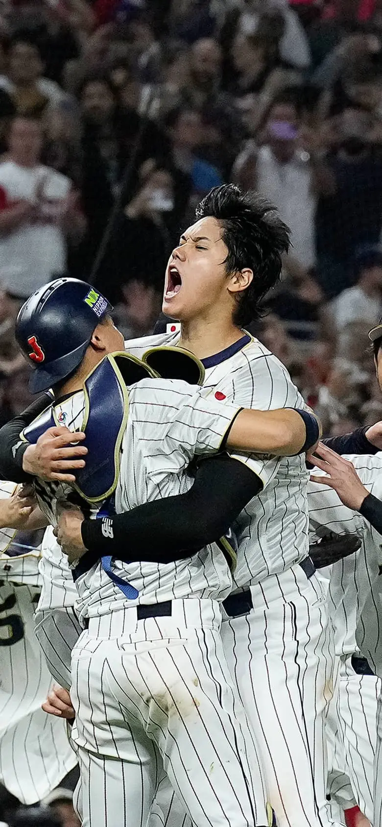 Shohei Ohtani and teammates celebrating their victory at the WBC